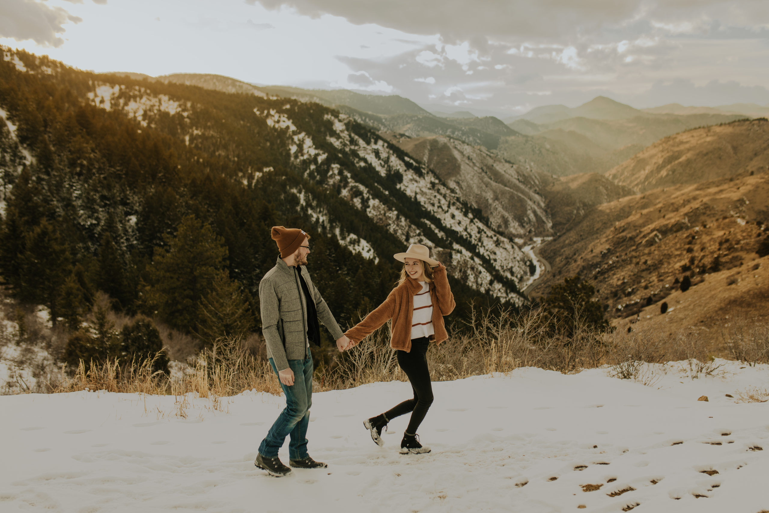 couple holding hands in Colorado mountains