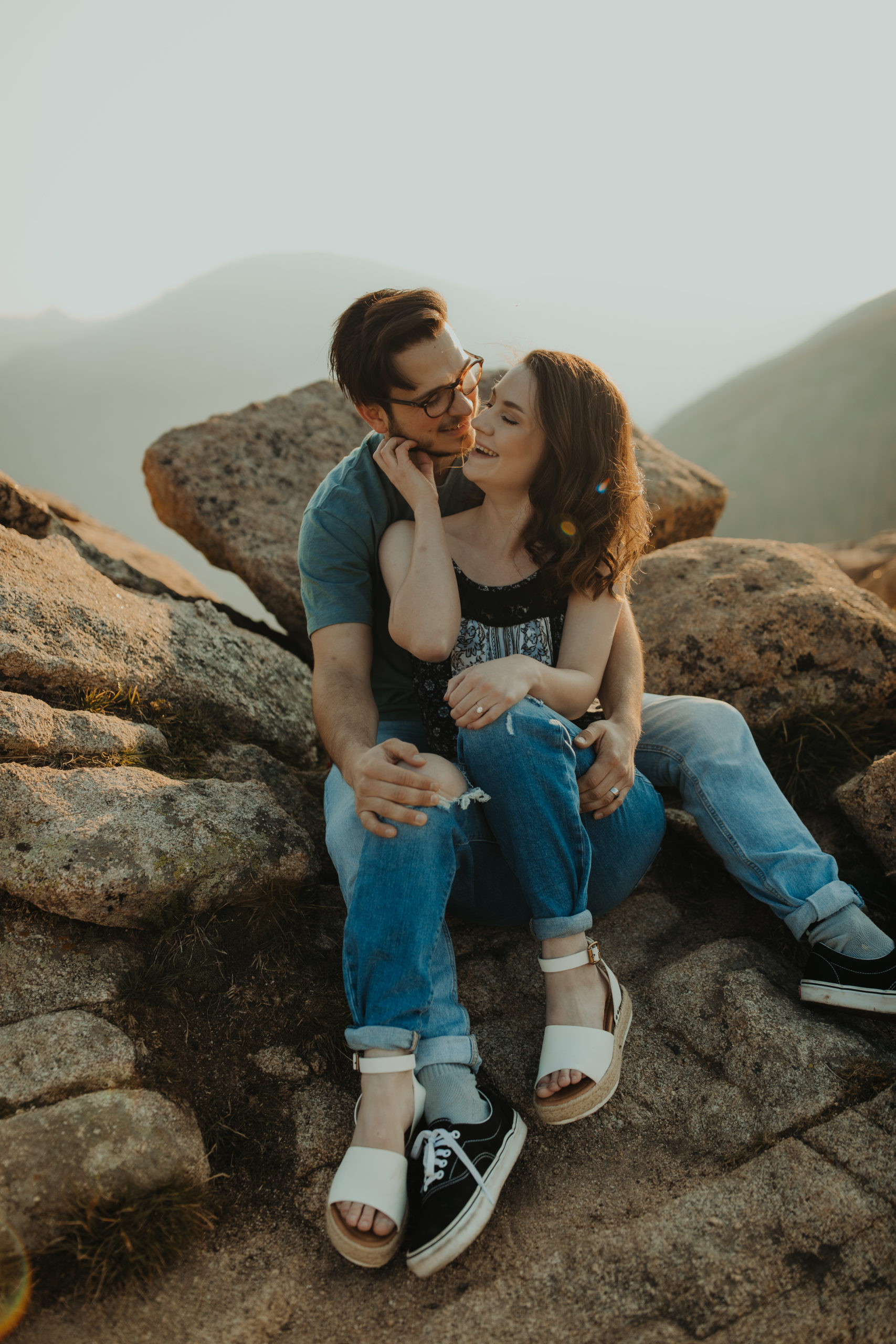 Close up of couple cuddled on the rocks in Colorado
