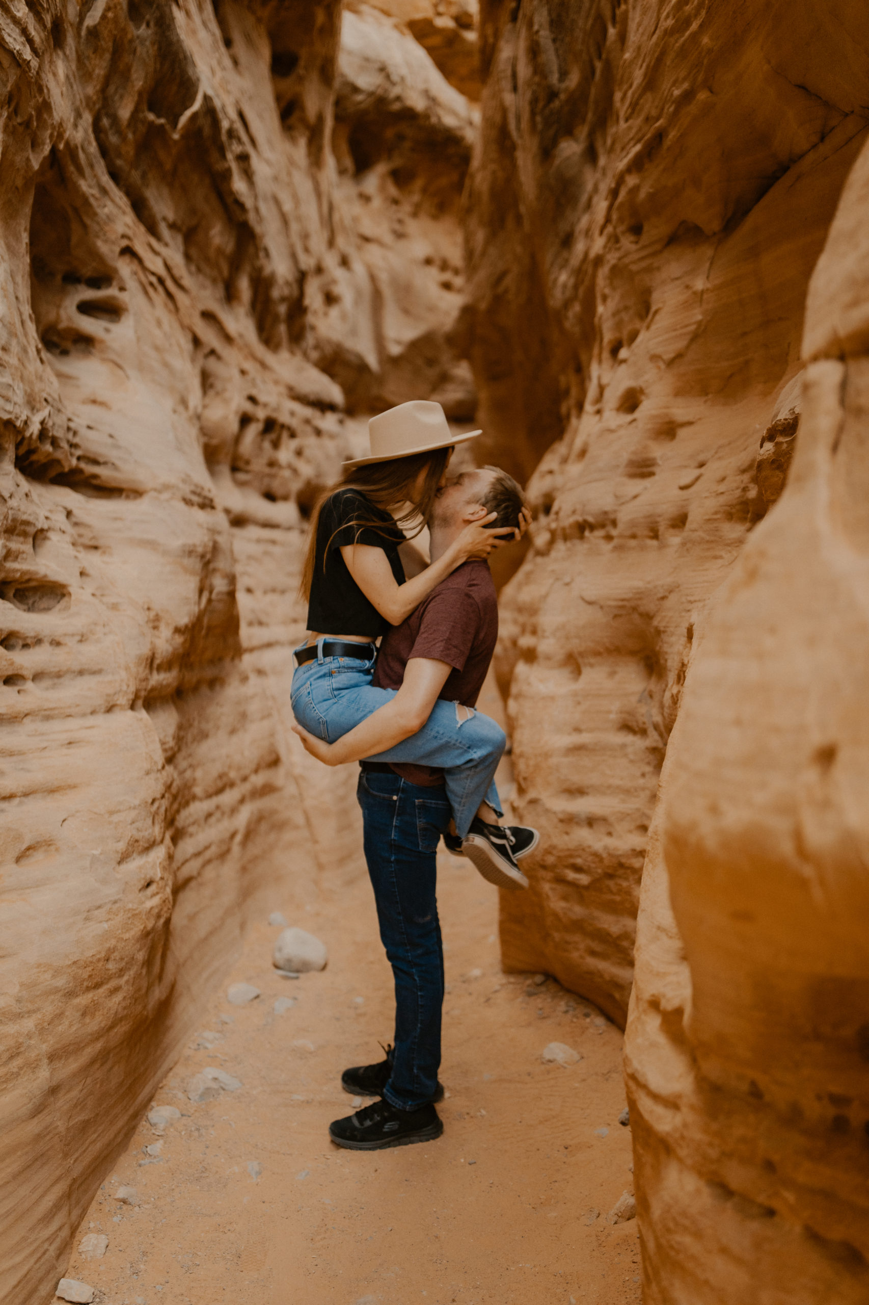 couple kissing during engagement session in valley of fire