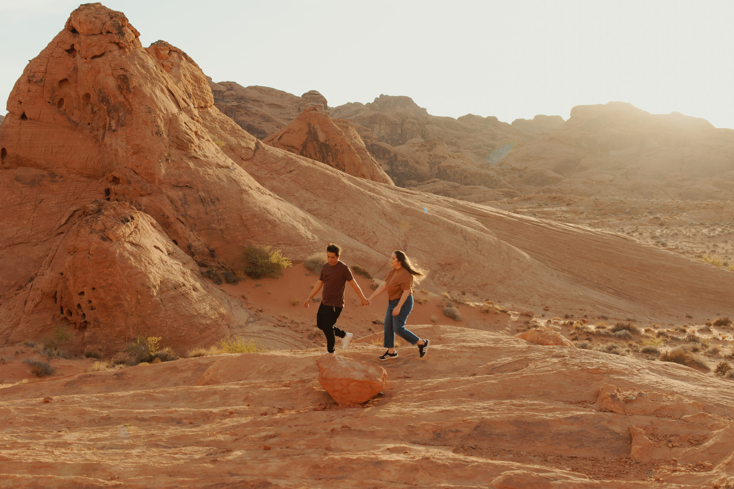 Landscape photo of couple standing in valley of fire