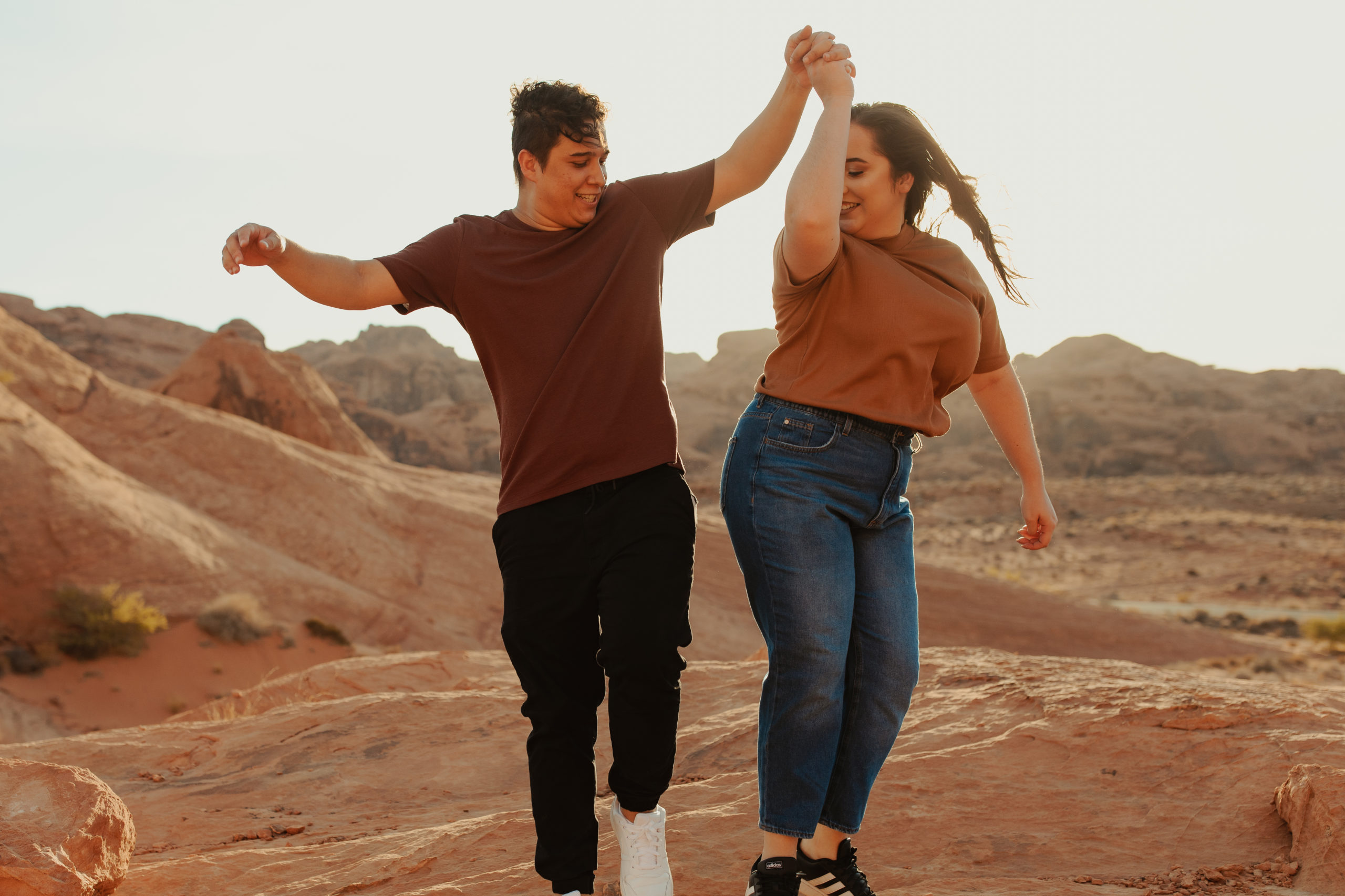 Cute couple being playful during their desert couples photoshoot