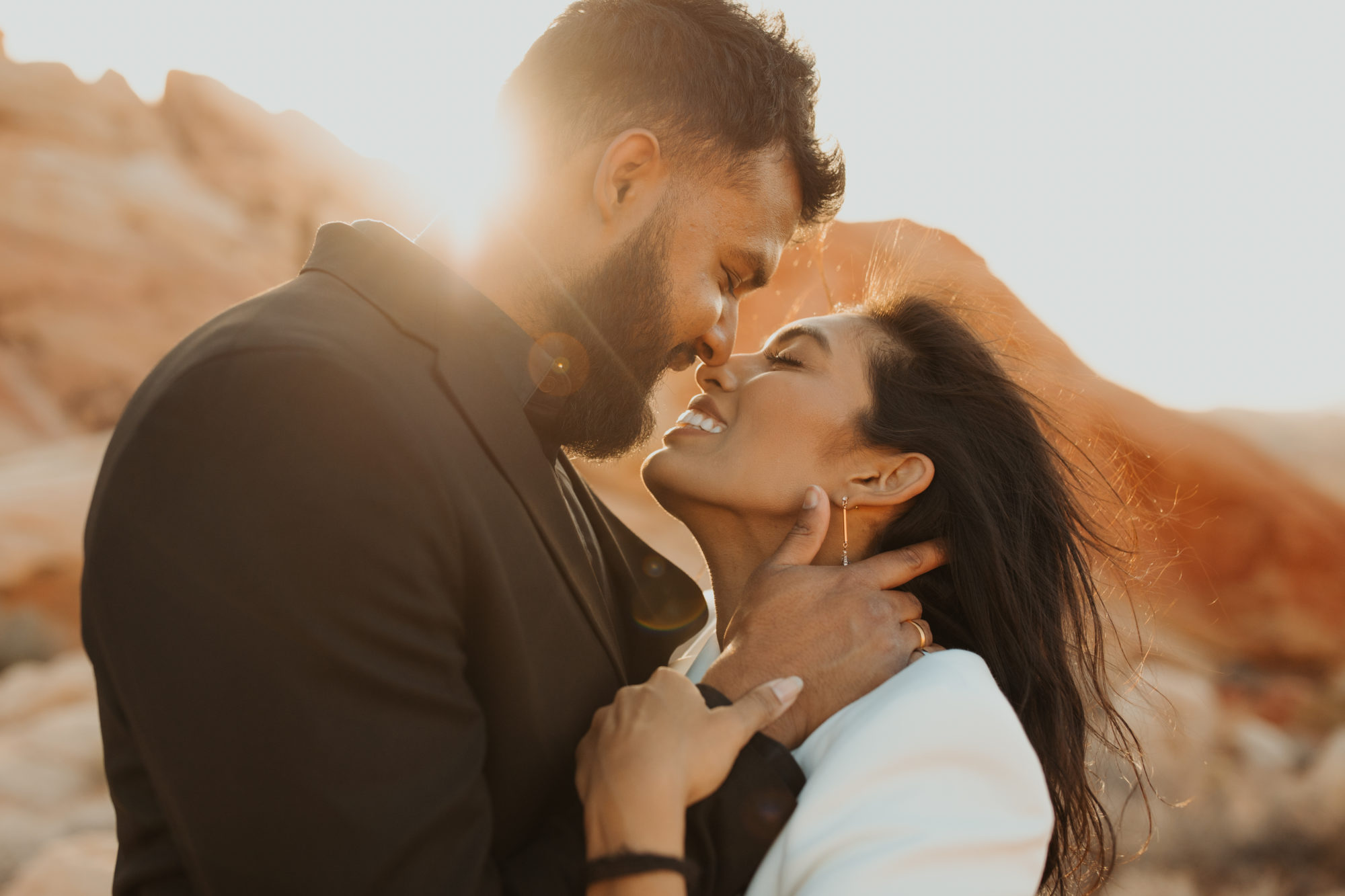 close-up photos of couples faces during their desert engagement session