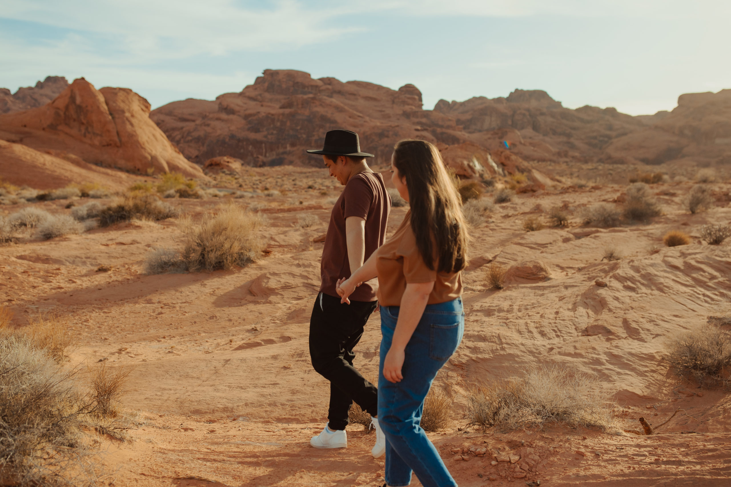 couple walking through the desert