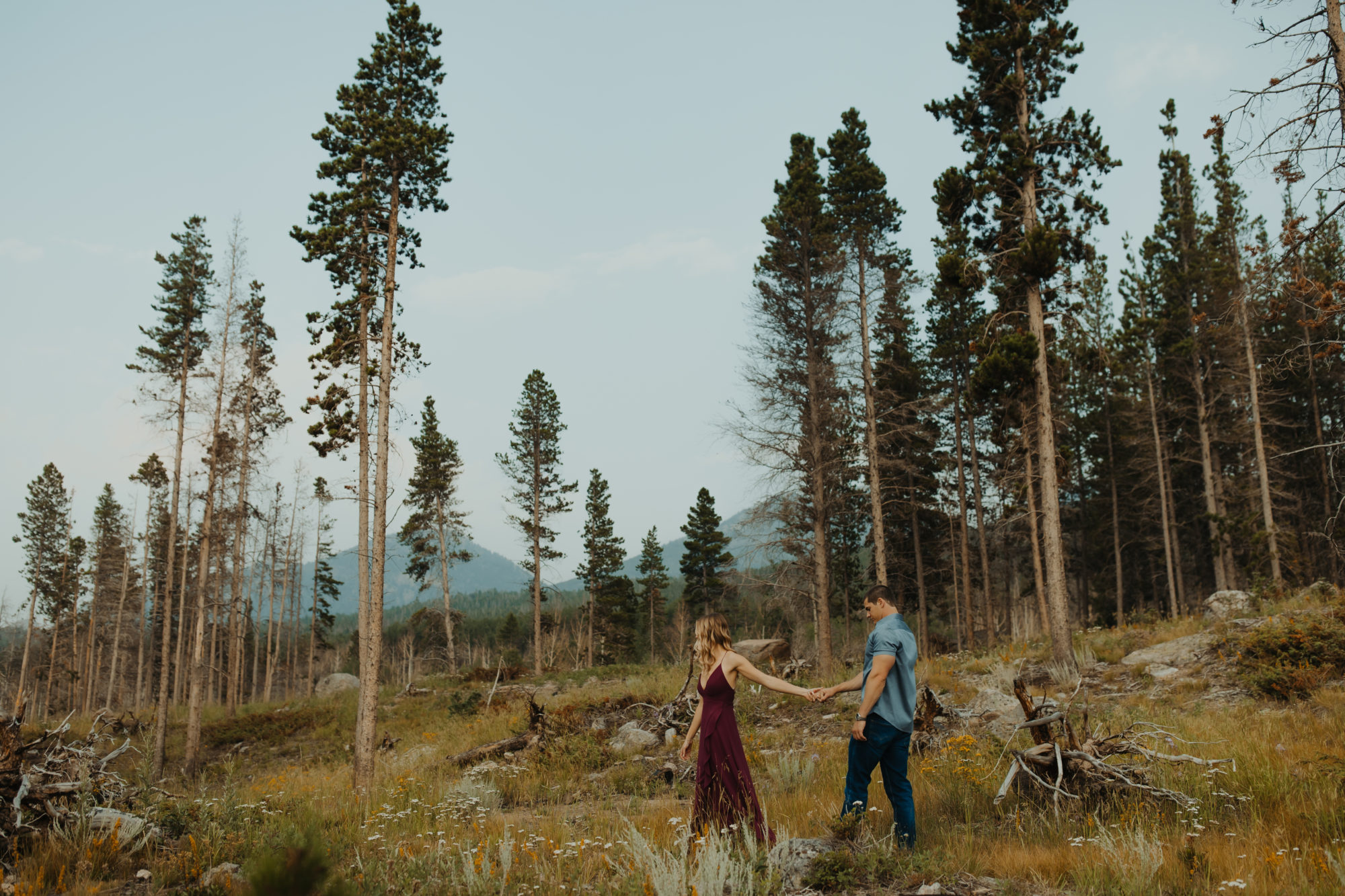 couple walking through a forest in the PNW