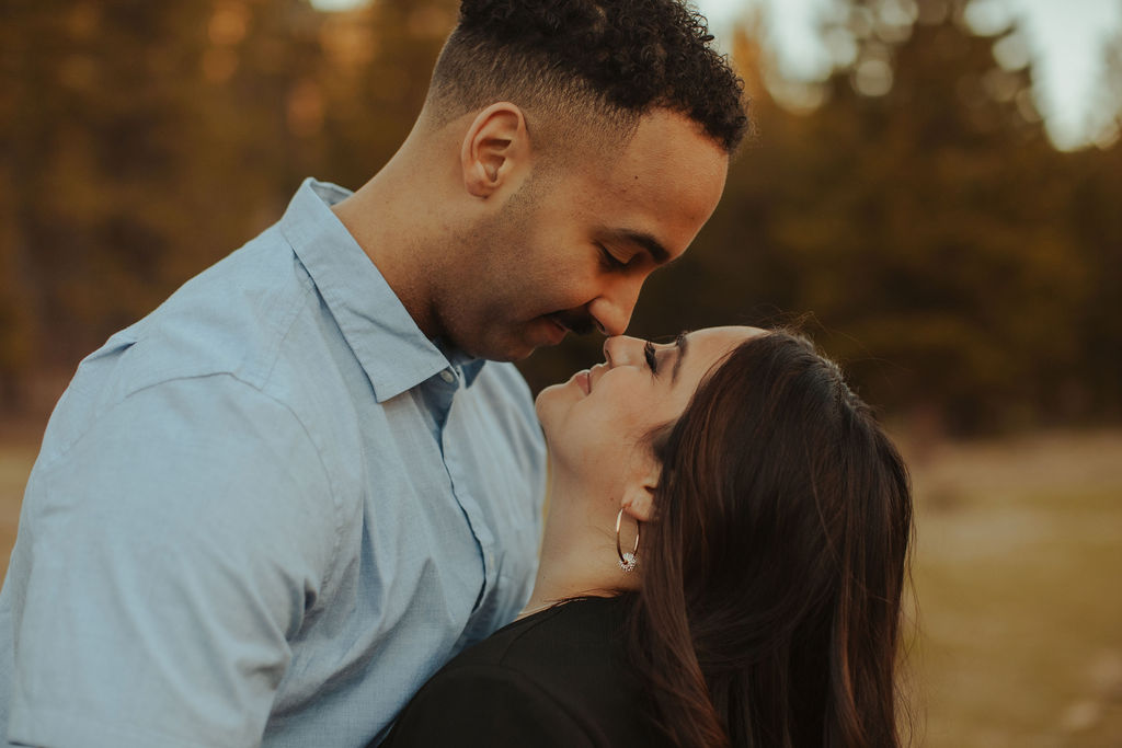 closeup portrait of couple nose to nose during their engagement session at mt. charleston nevada
