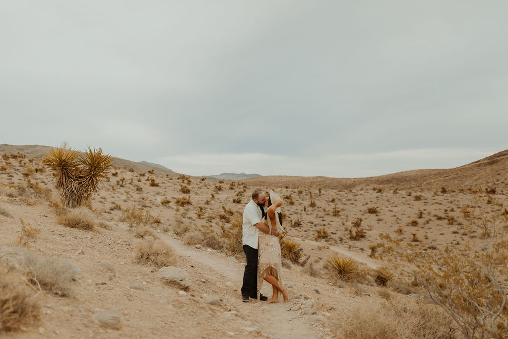 Couple kissing in the desert in Red Rock Canyon Las Vegas during their vow renewal
