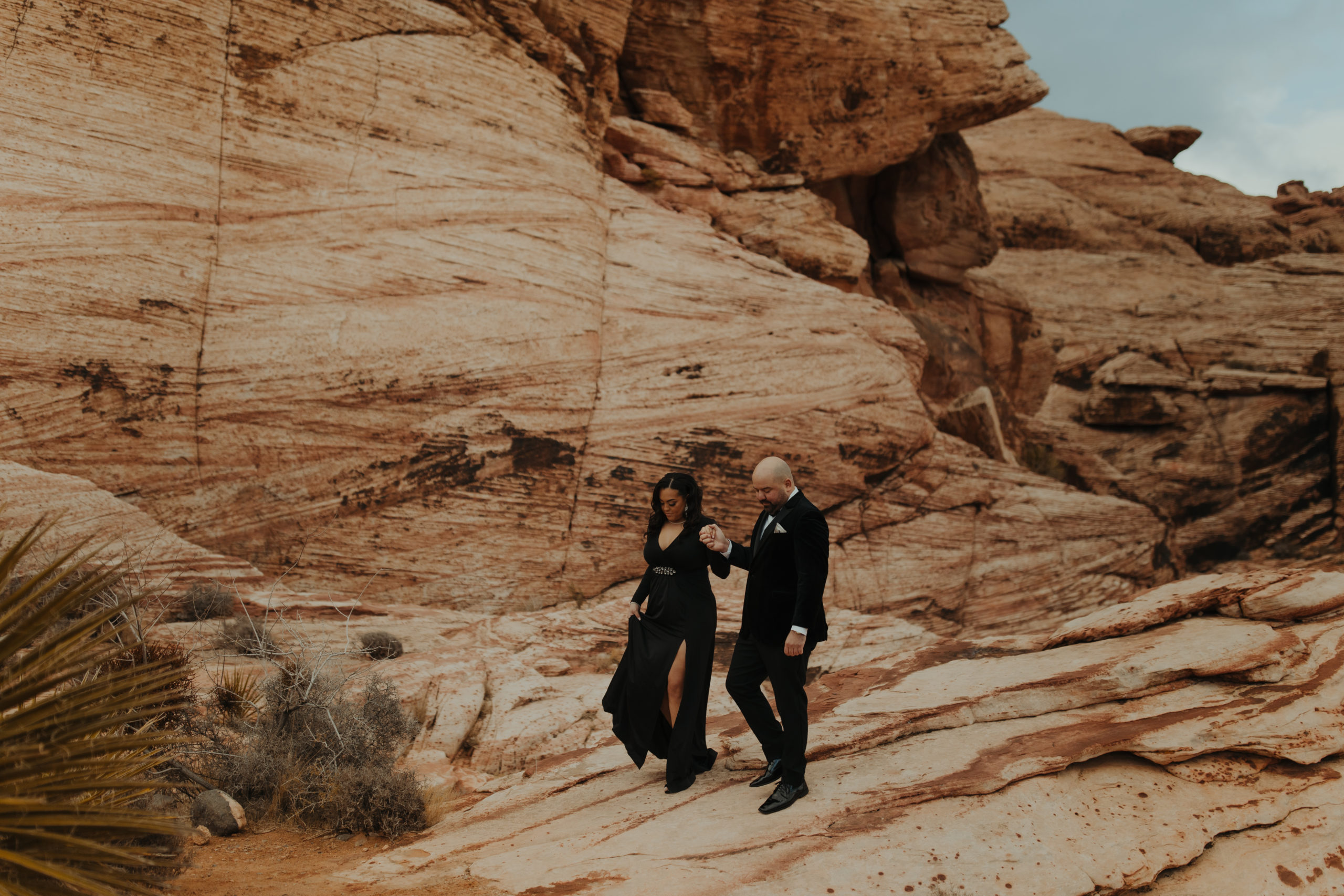 Couple posing for elopement photos in Red Rock Canyon for unique places to elope