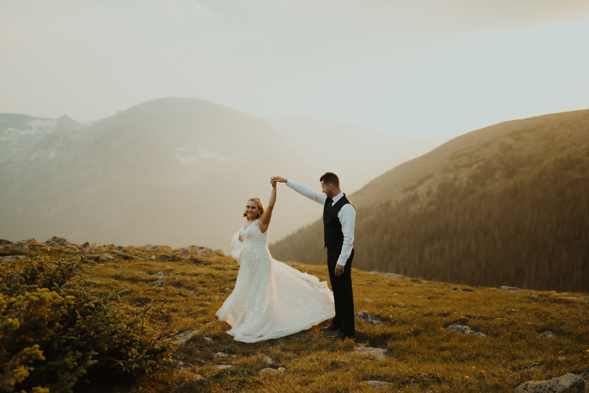 Bride and groom sharing their first dance on trail ridge road in rocky mountain national park