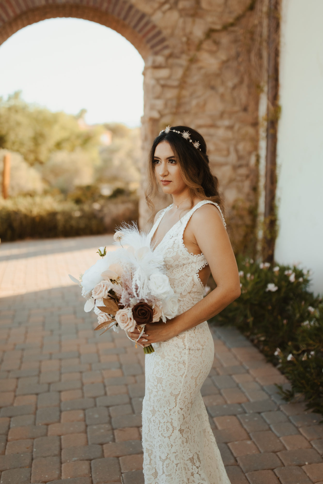 photo of bride outside the wedding venue showcasing her bridal bouquet