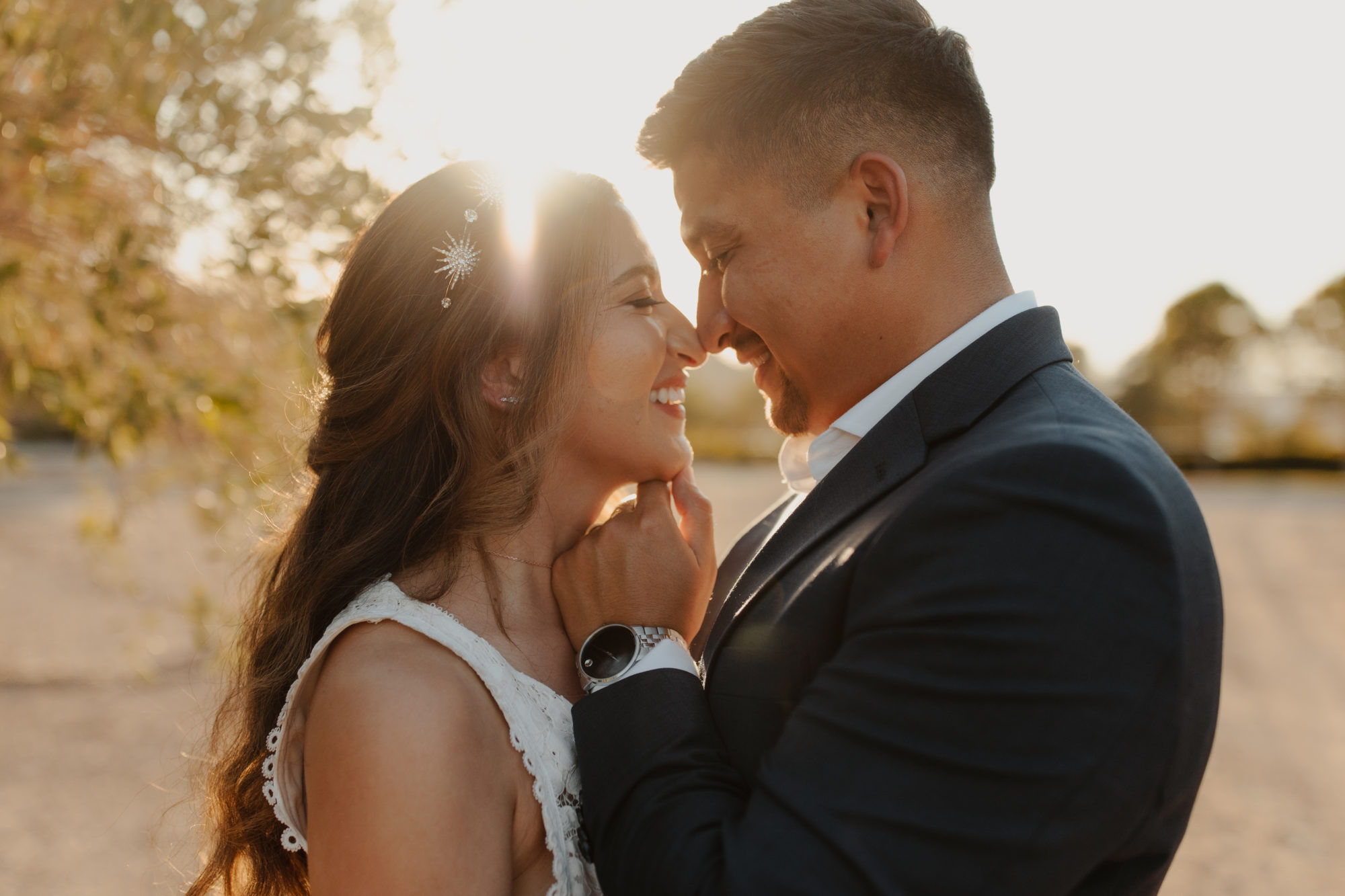 bride and groom nose to nose during golden hour