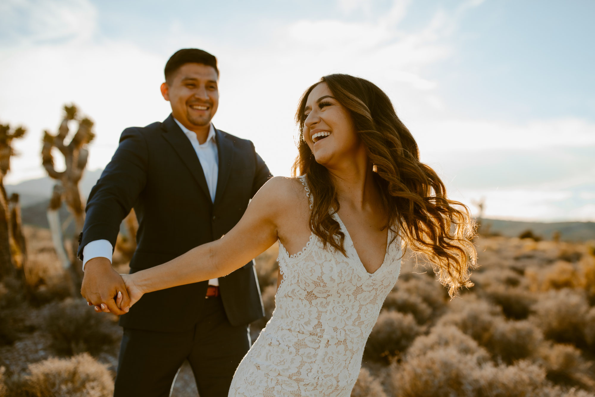 Couple posing during day after couples wedding photos in the desert