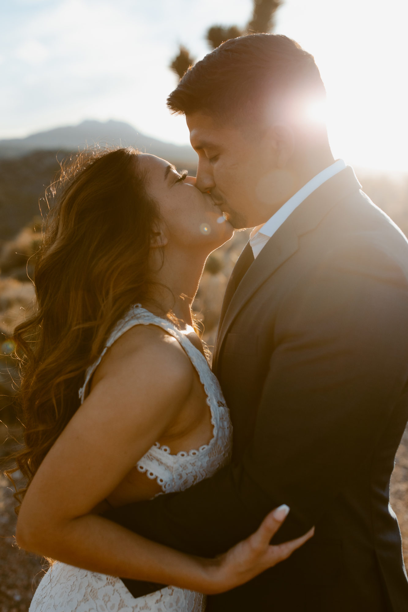 Couple kissing during post wedding session 