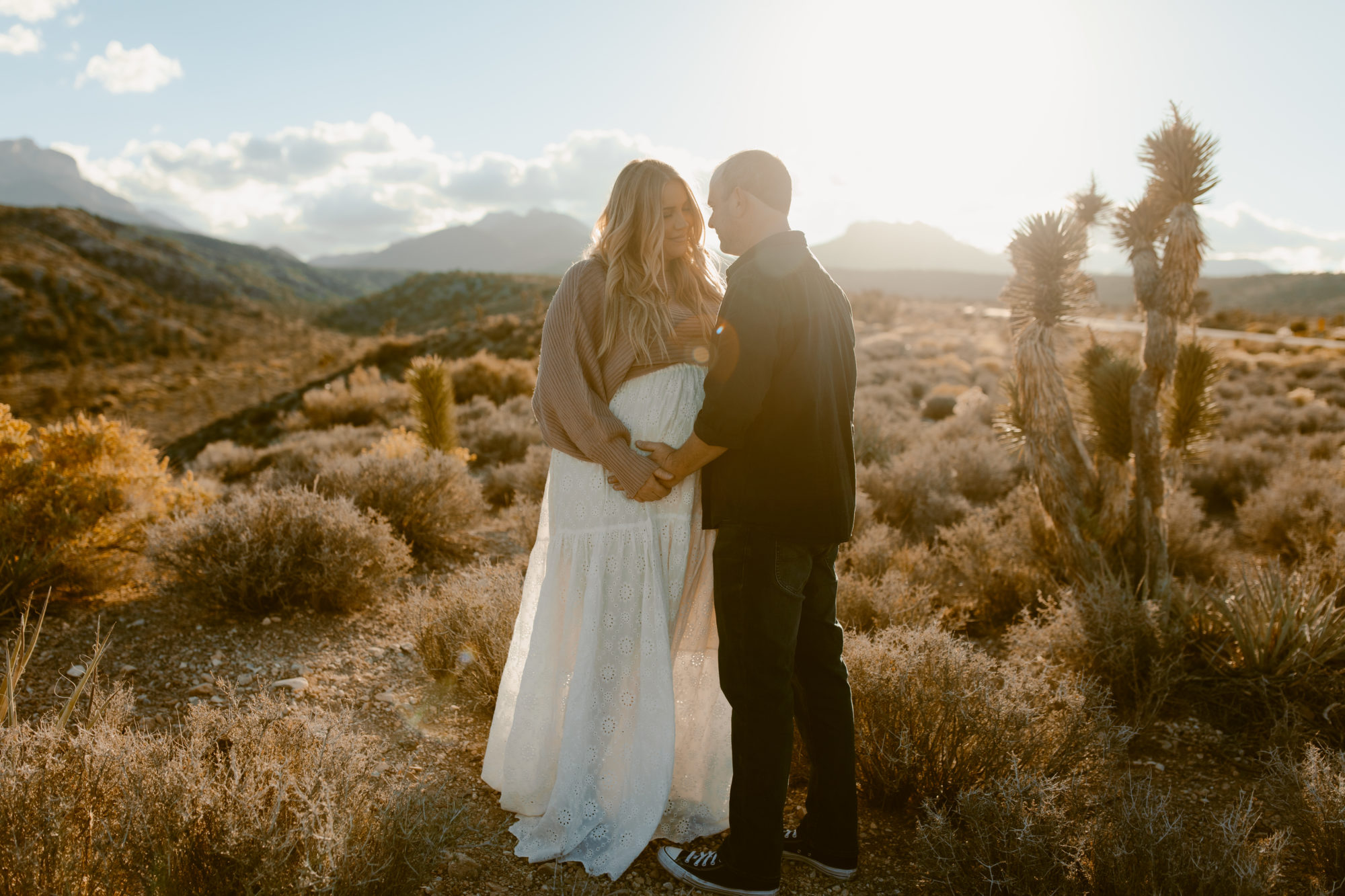 Couple during desert maternity photoshoot
