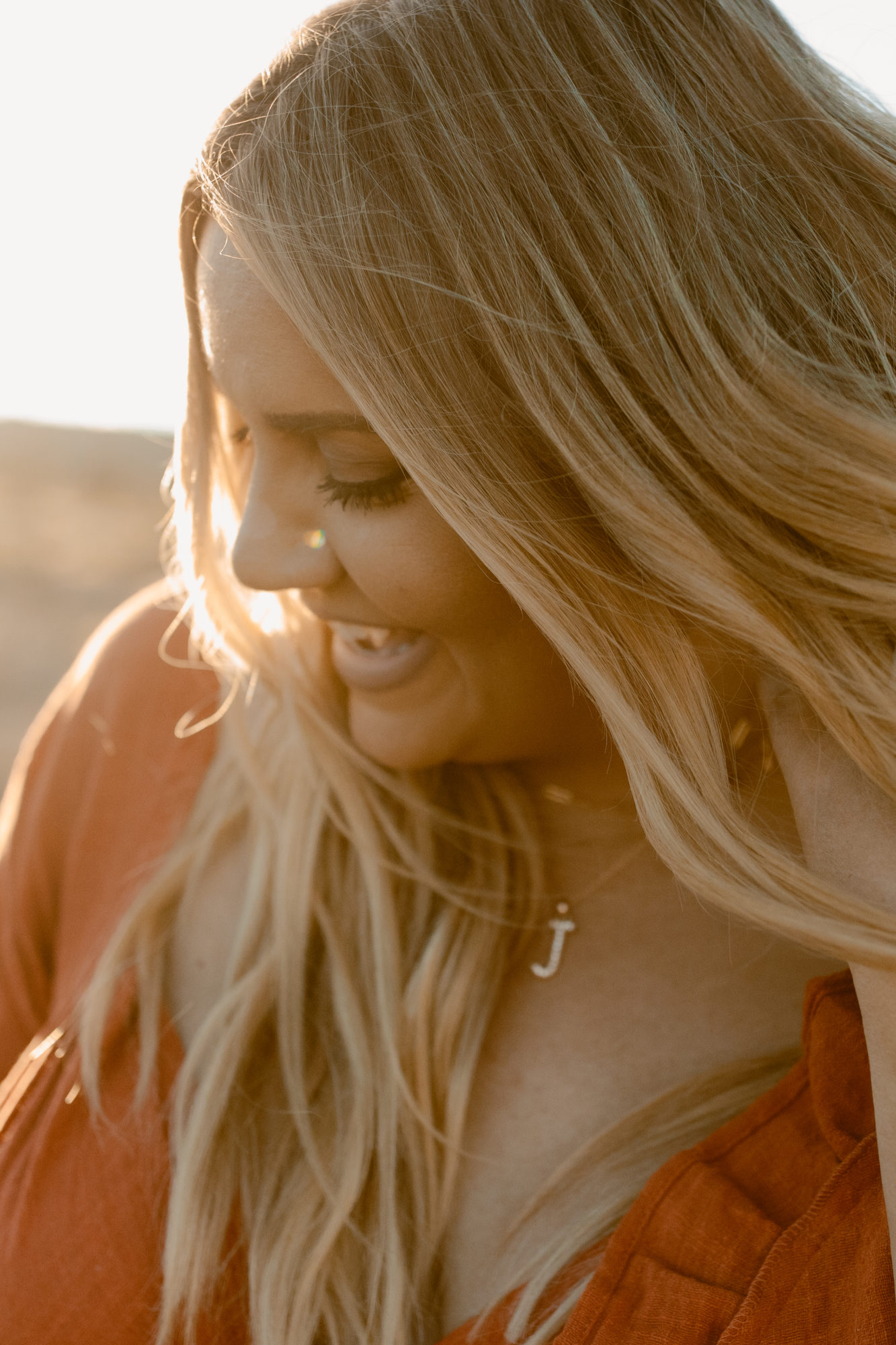 Woman smiling during desert photoshoot