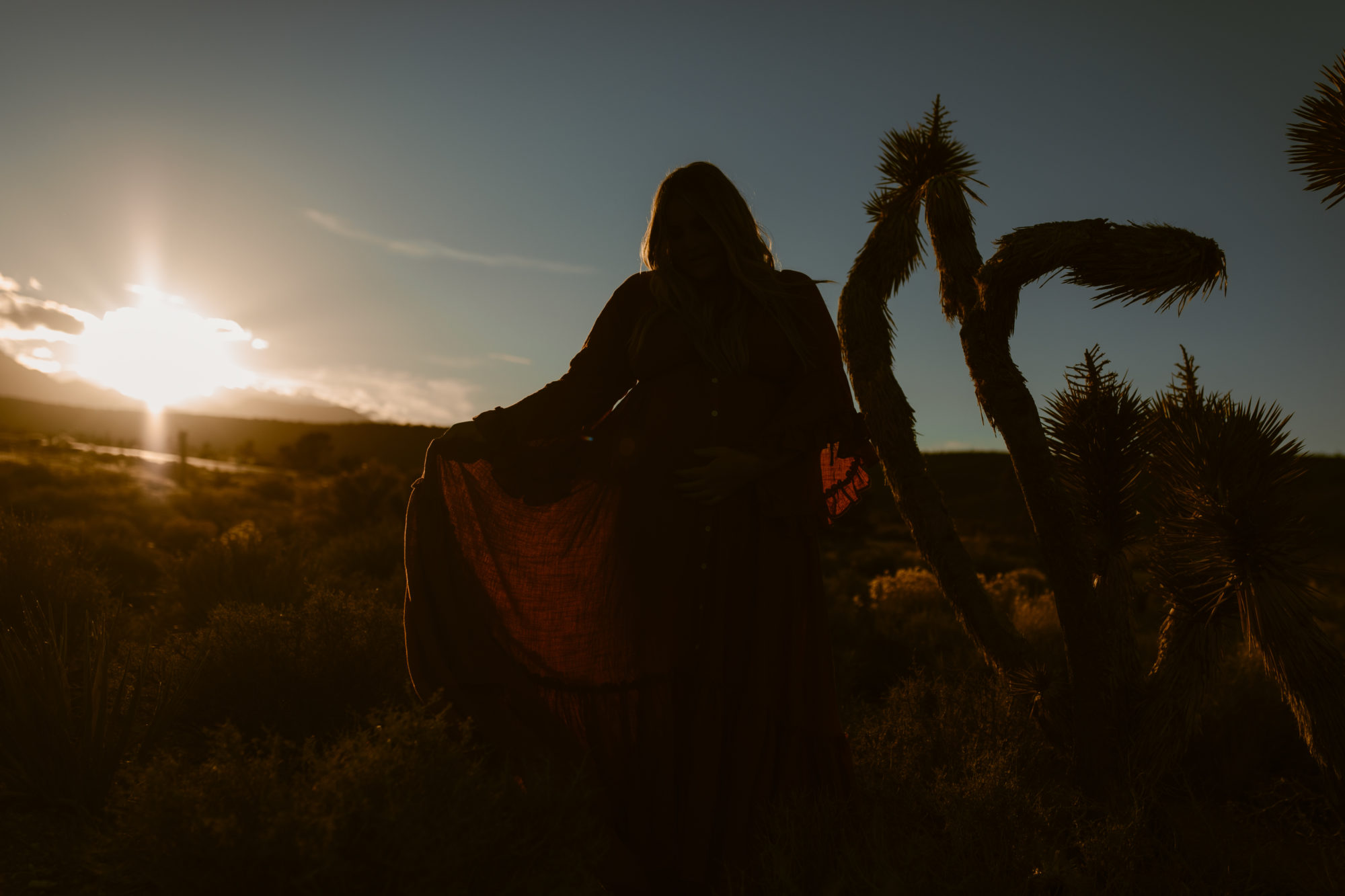 Woman posing during sunset desert photoshoot 