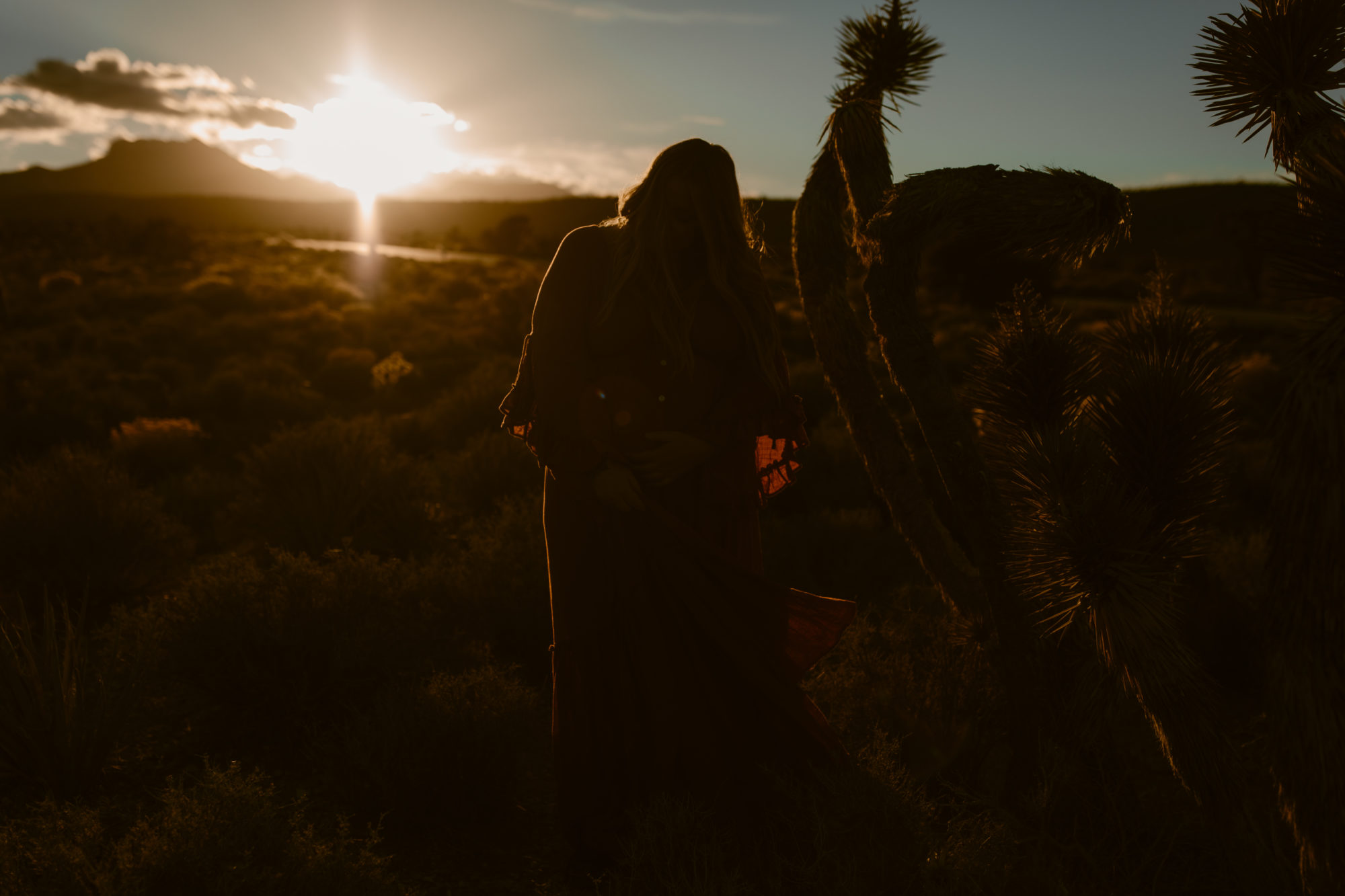 Woman posing during sunset desert photoshoot