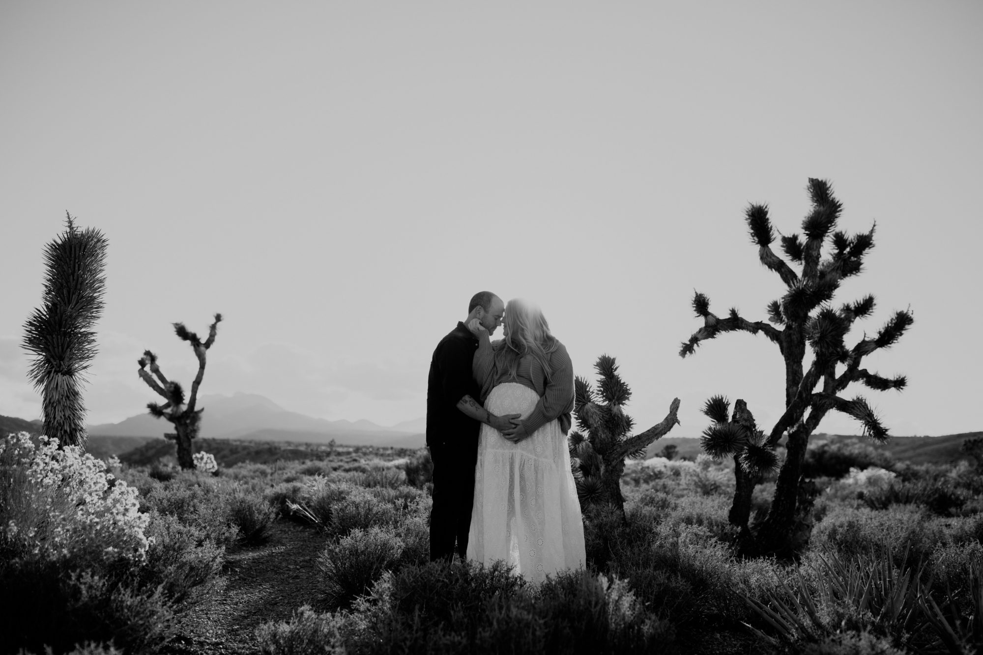 Husband and wife posing for desert photoshoot 