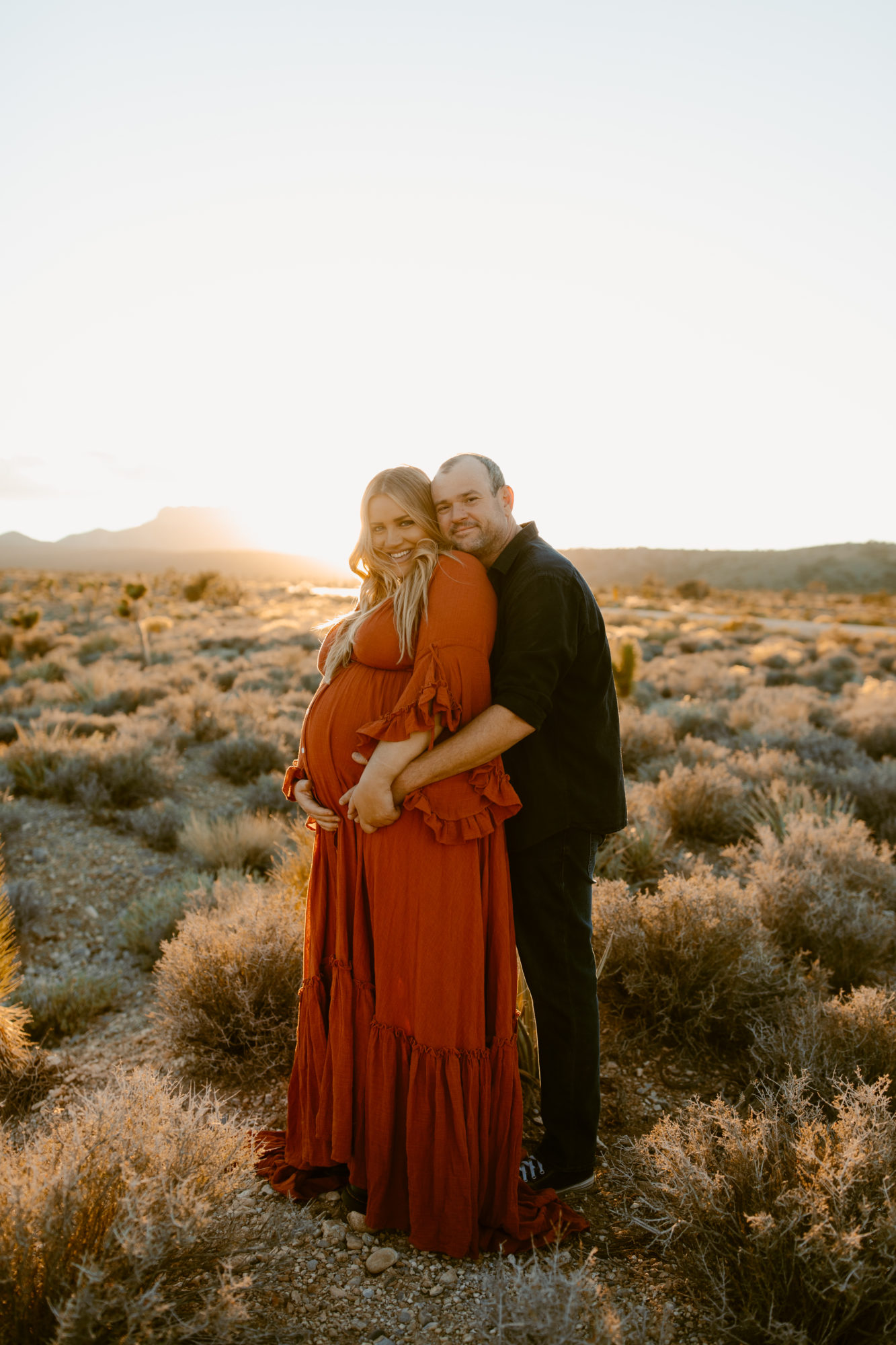 Husband and wife posing for desert photos