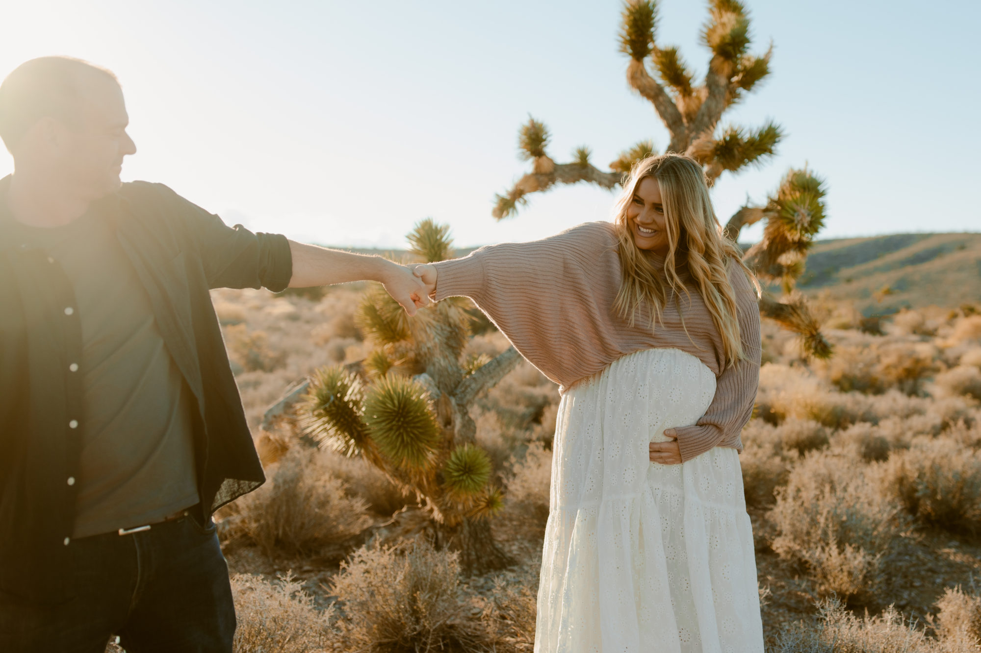 Husband and wife posing for desert photoshoot 