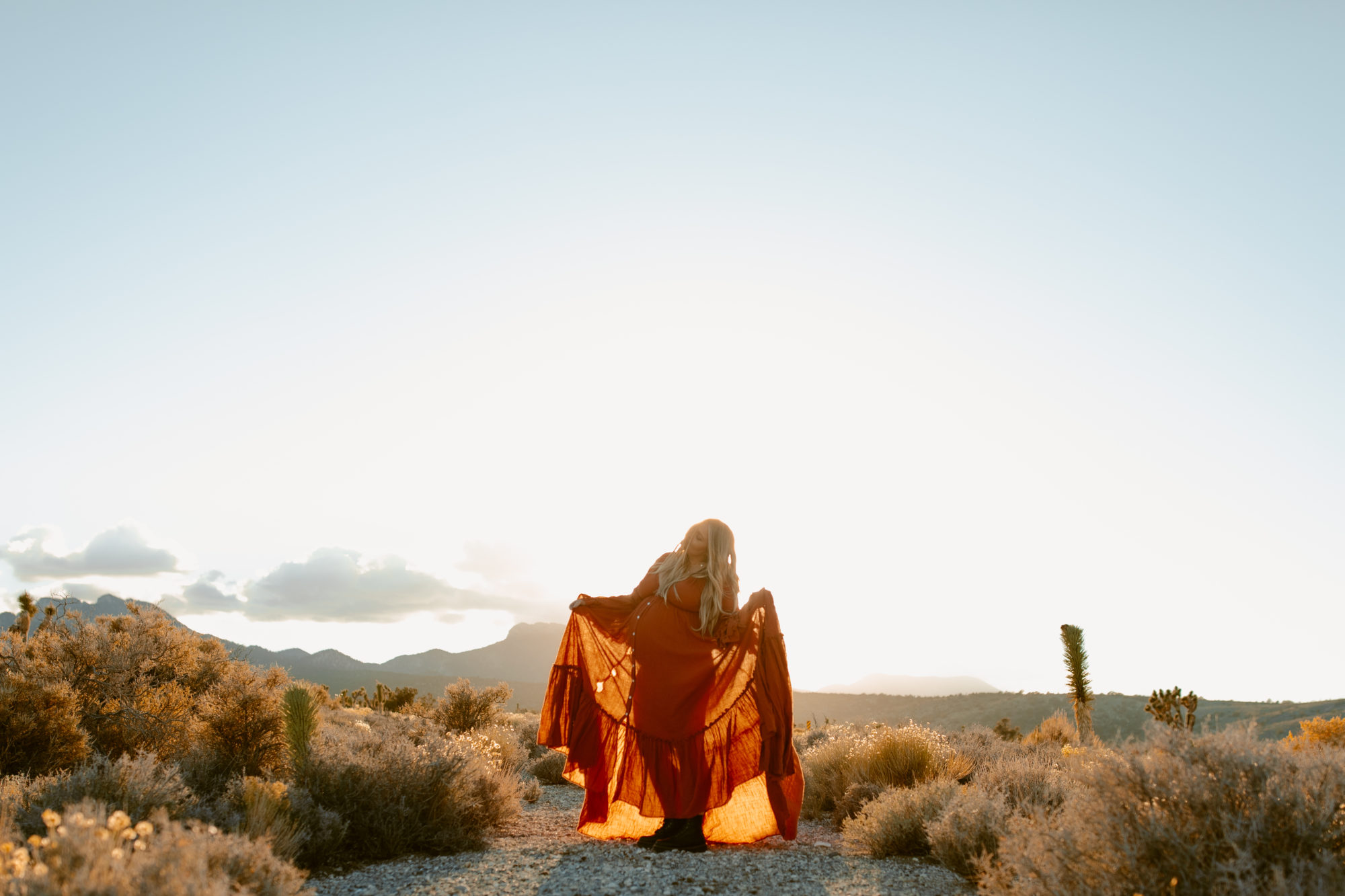 Woman posing in the desert for photoshoot 