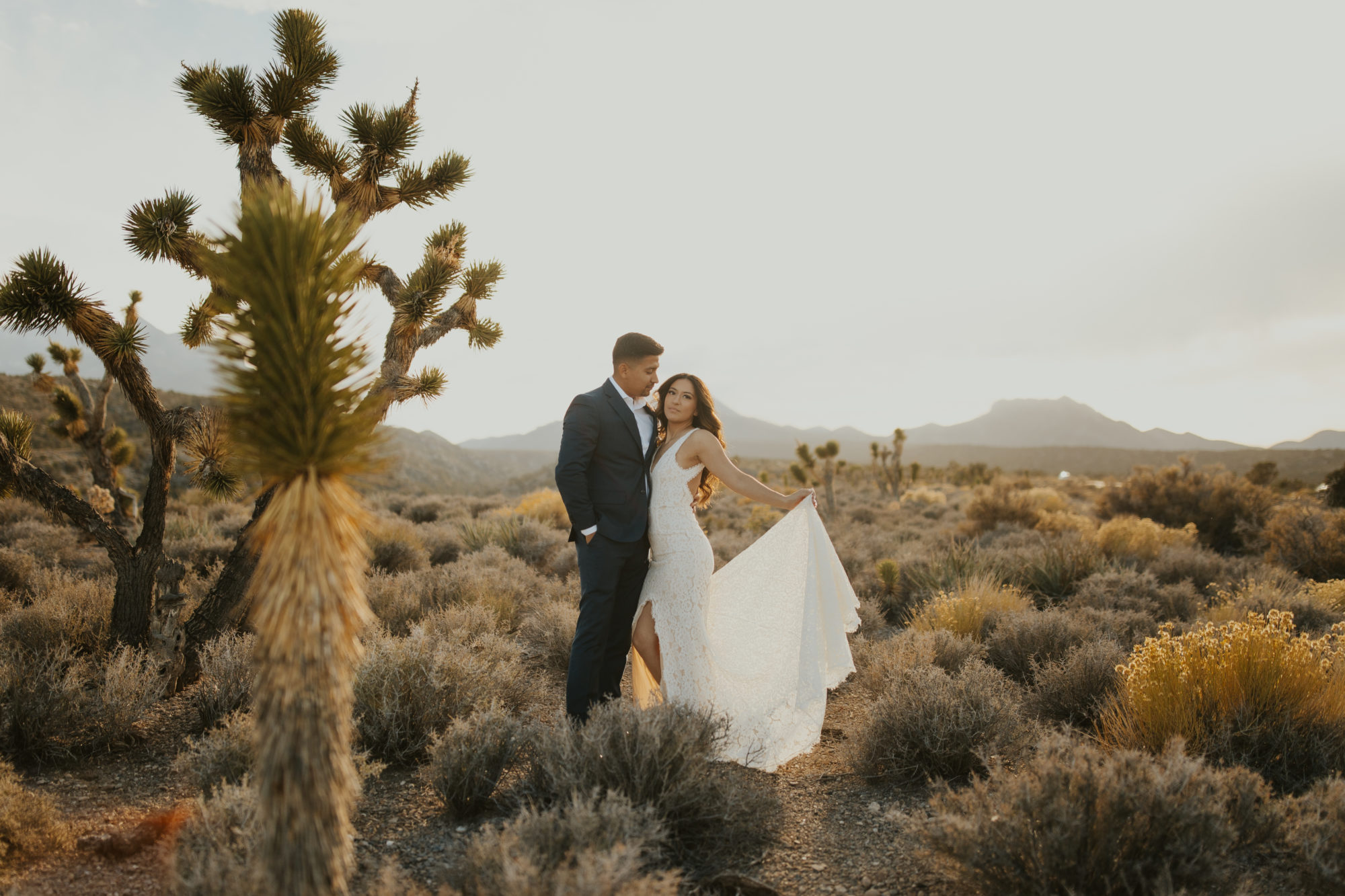 Couple taking elopement photos in the Mojave desert for unique places to elope