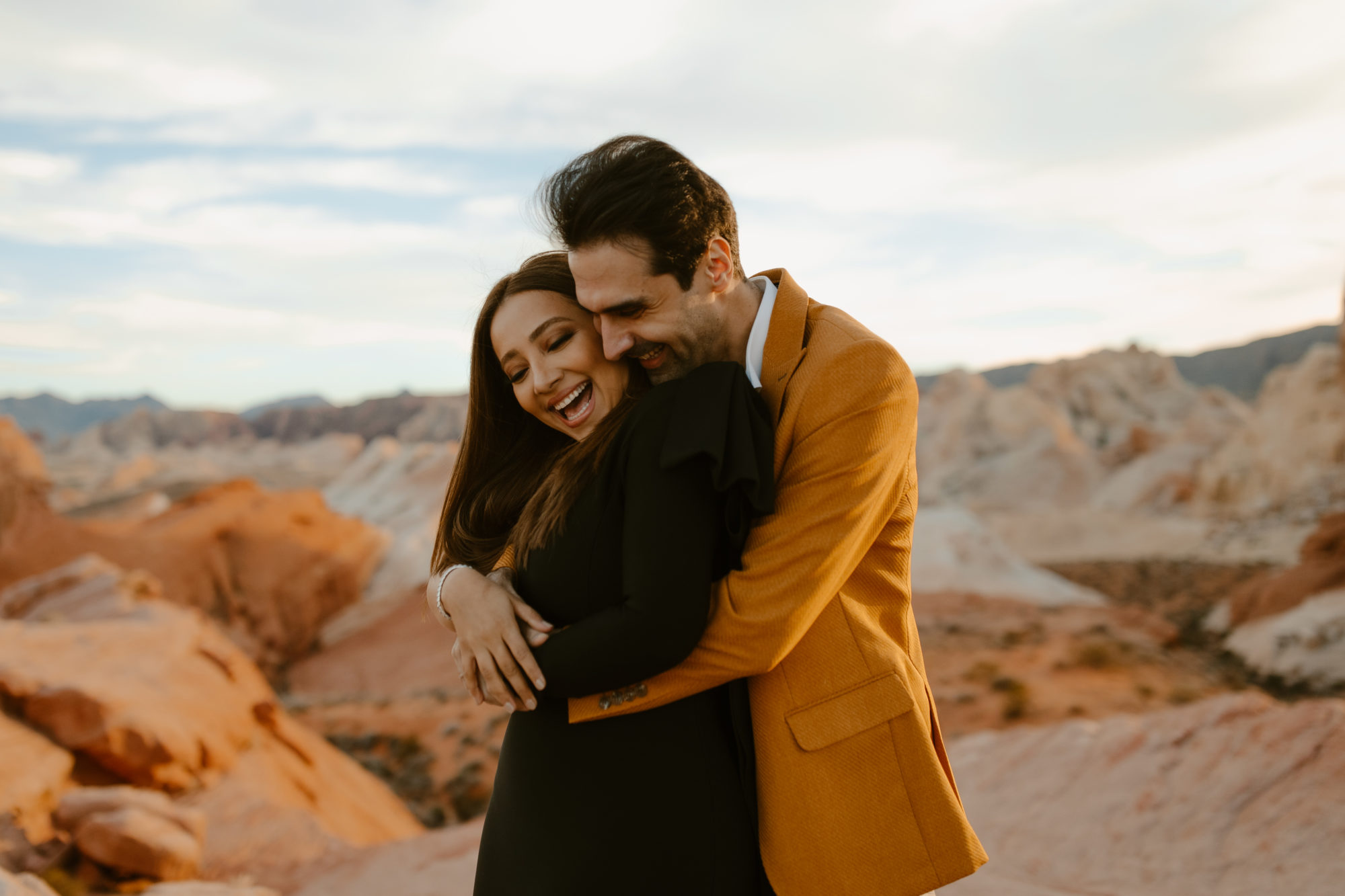 Couple posing for adventurous desert photoshoot in Nevada