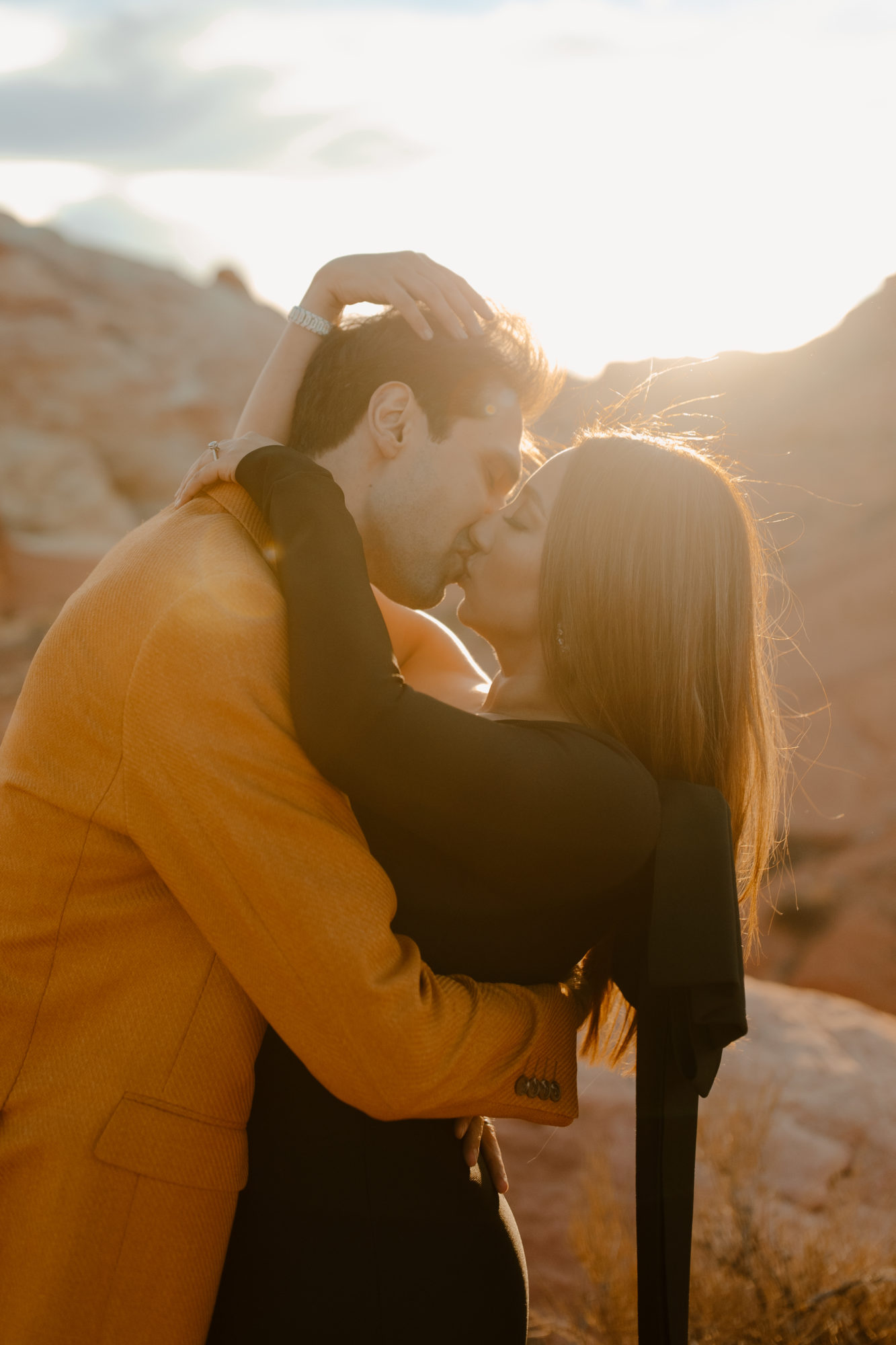 Couple kissing for adventurous desert photoshoot in Nevada